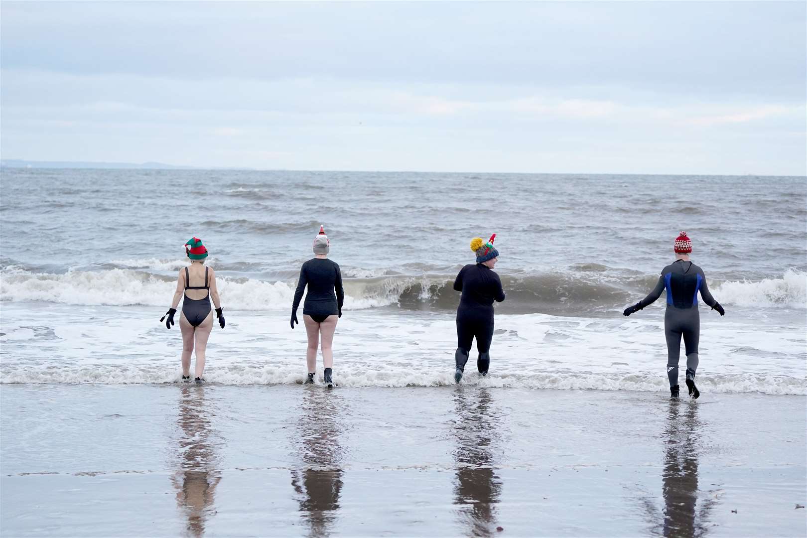 Swimmers take a Christmas Day dip at Portobello Beach (Andrew Milligan/PA)