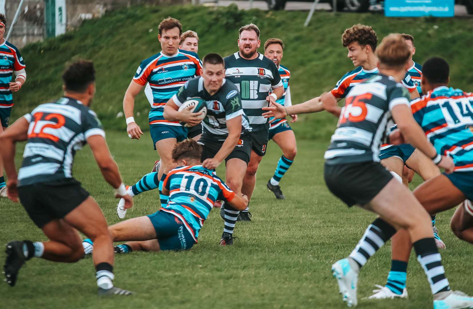 Gravesend's George Bruce on the charge against Reeds Weybridge - the sides were separated by just two points on Saturday. Picture: jp_photographeruk