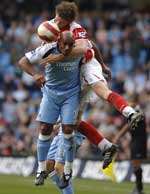 Herman Hreidarsson climbs above Trevor Sinclair. Picture: MATT WALKER