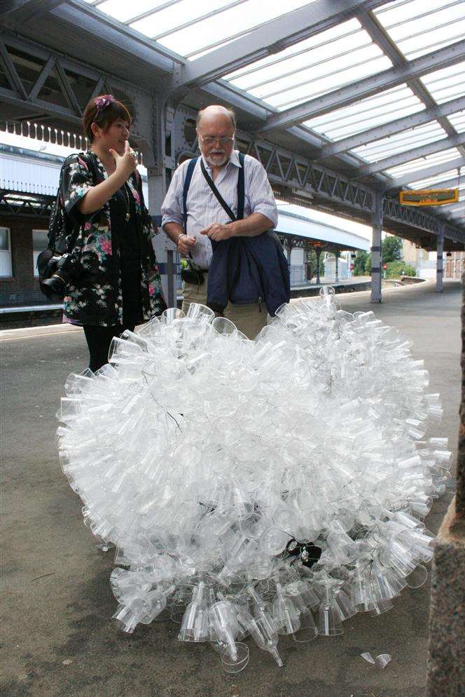 MA student Gigi Yutz and Steve Villette, of Margate Civic Society, discuss Gigi's art Fallen Memories from Heaven