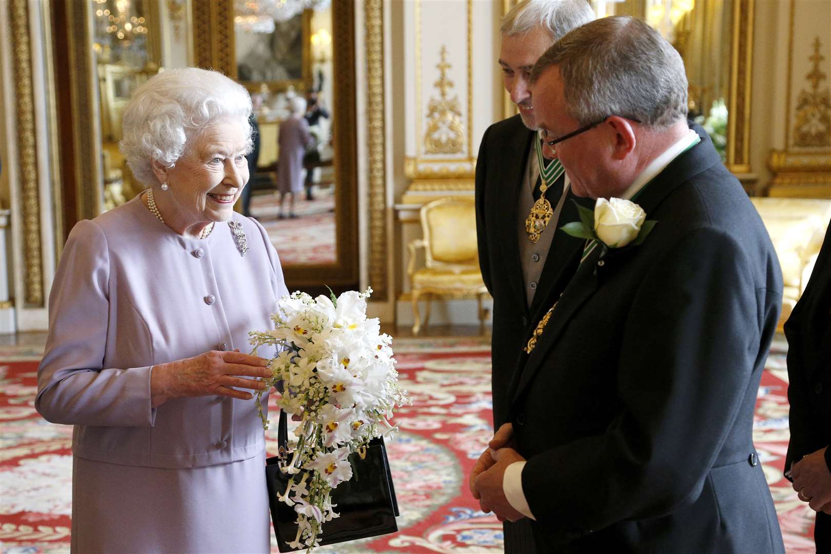 A replica of the coronation bouquet is presented to Queen by the Worshipful Company of Gardeners in 2013 (Jonathan Brady/PA)