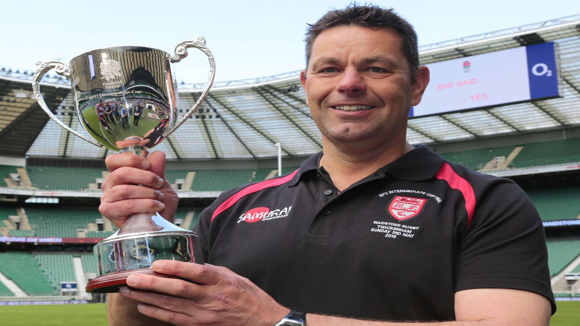 Maidstone coach Paul Hathaway with the trophy. Picture: Martin Apps