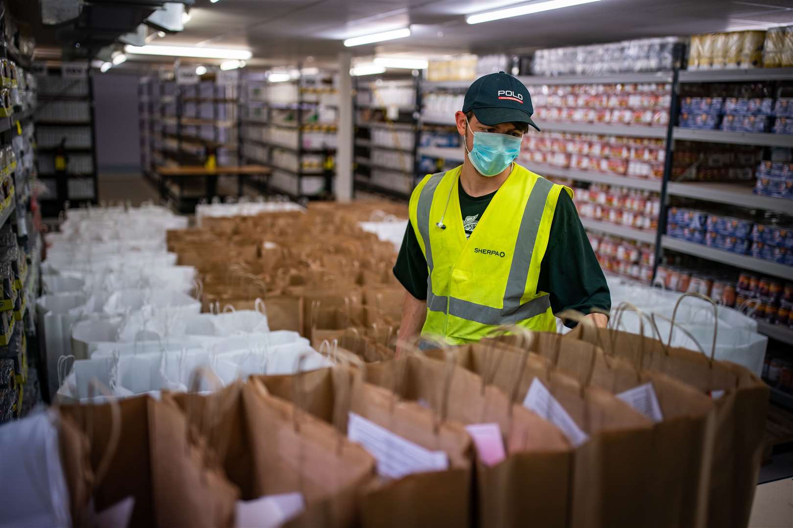 Food supplies are sorted at a depot for a new pan-London partnership (Aaron Chown/PA)