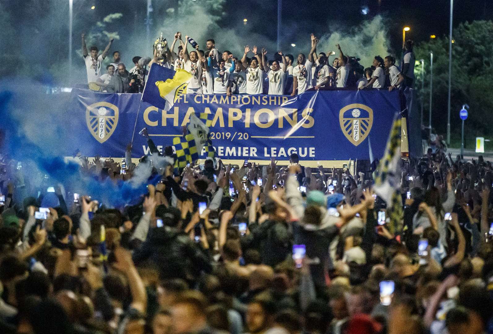 Leeds United players on a bus in front of fans outside Elland Road (Danny Lawson/PA)