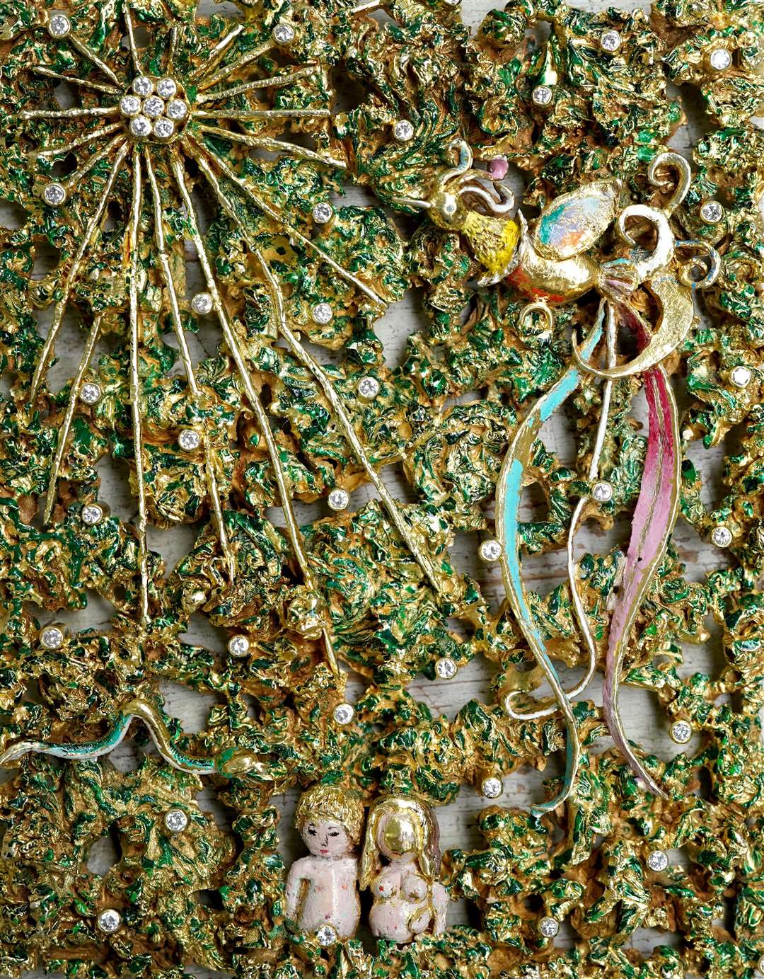 A view of a unique necklace with a pendant depicting the Garden of Eden, with Adam and Eve, by Anton Fruhauf of Meran, Italy (Gareth Fuller/PA)