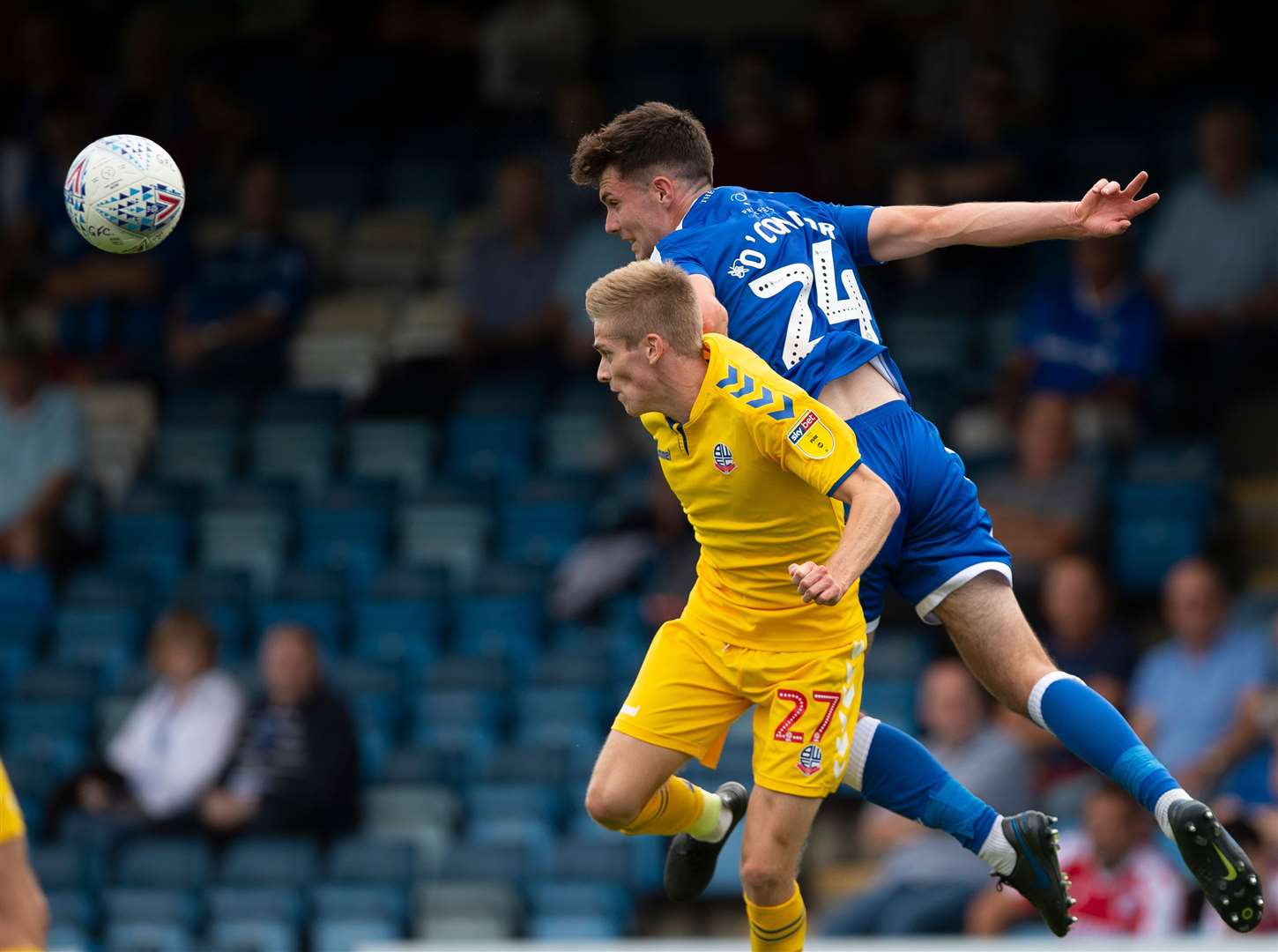 Tom O'Connor wins a header against Bolton Wanderers Picture: Ady Kerry