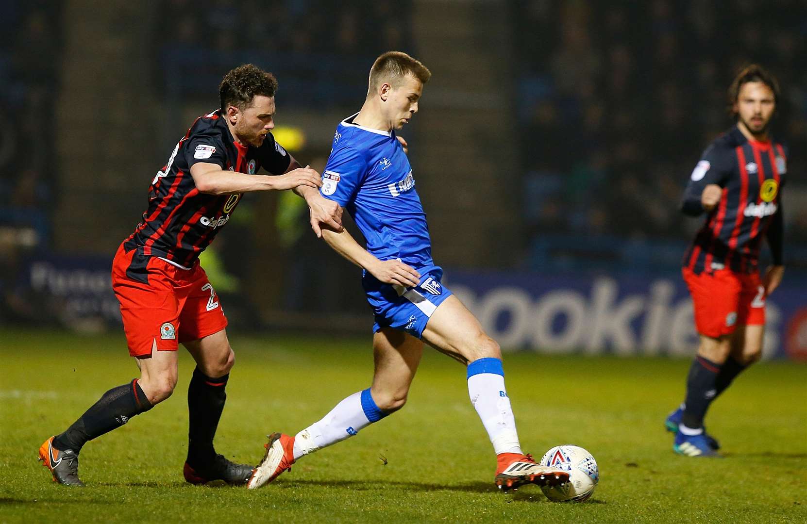 Jake Hessenthaler under pressure from Blackburn Rovers' Corry Evans Picture: Andy Jones