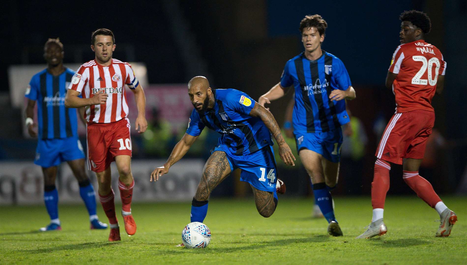 Gillingham's Josh Parker gets away from Josh Maja. Picture: Ady Kerry