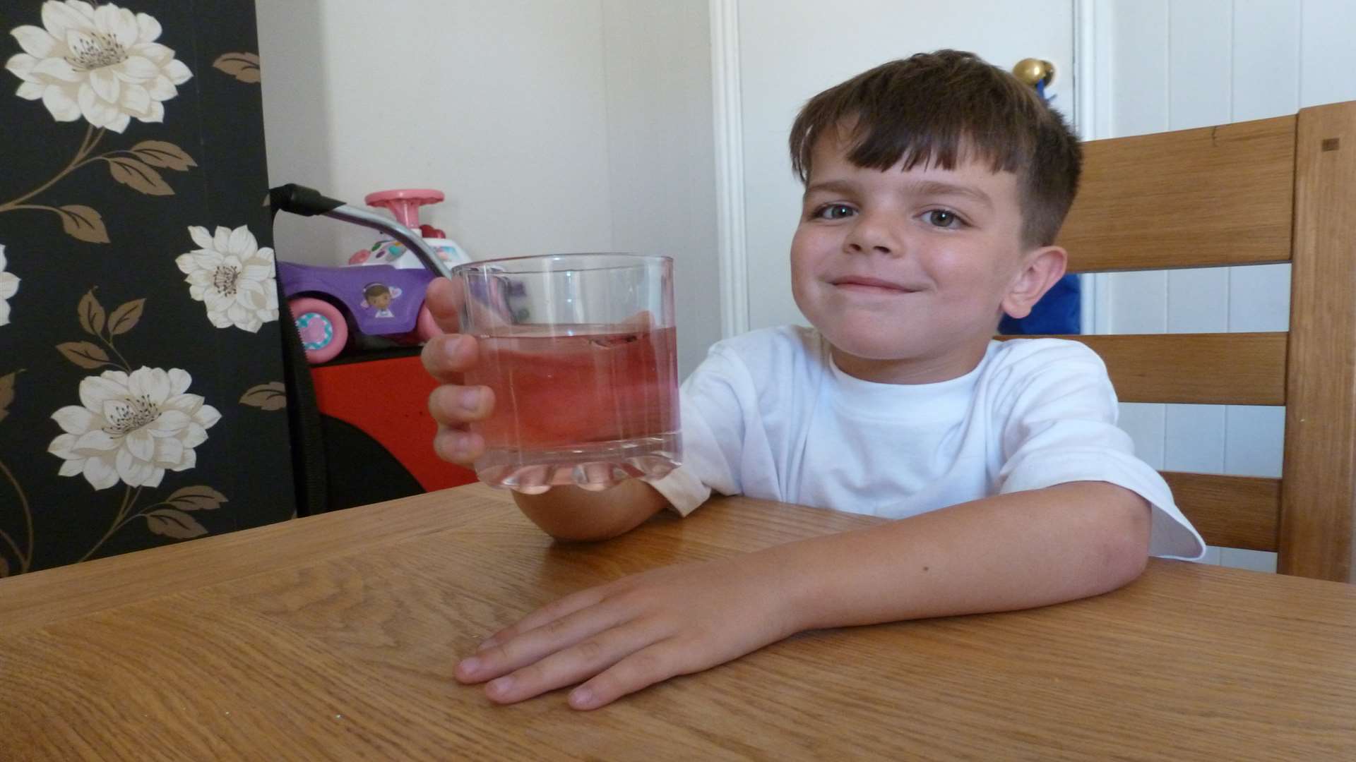 Jamie enjoying a glass of squash at home