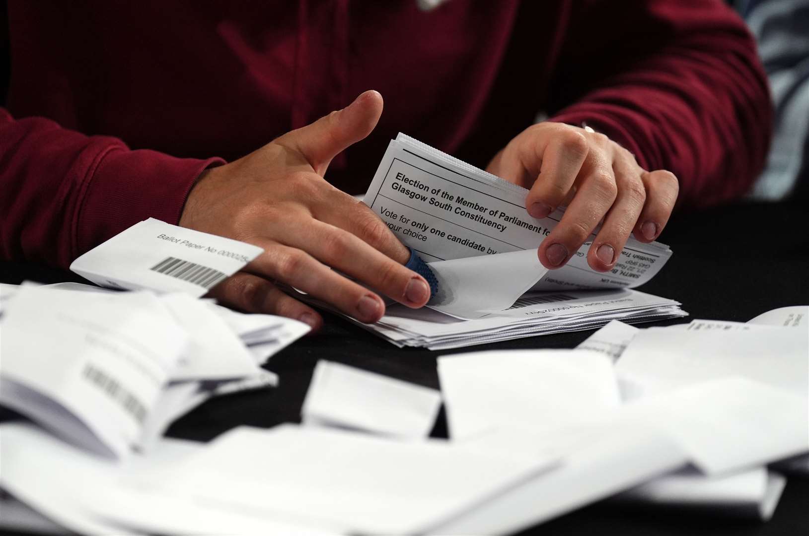 Ballot papers are counted at Emirates Arena in Glasgow, during the count for Glasgow Central and Glasgow South constituencies (Andrew Milligan/PA)