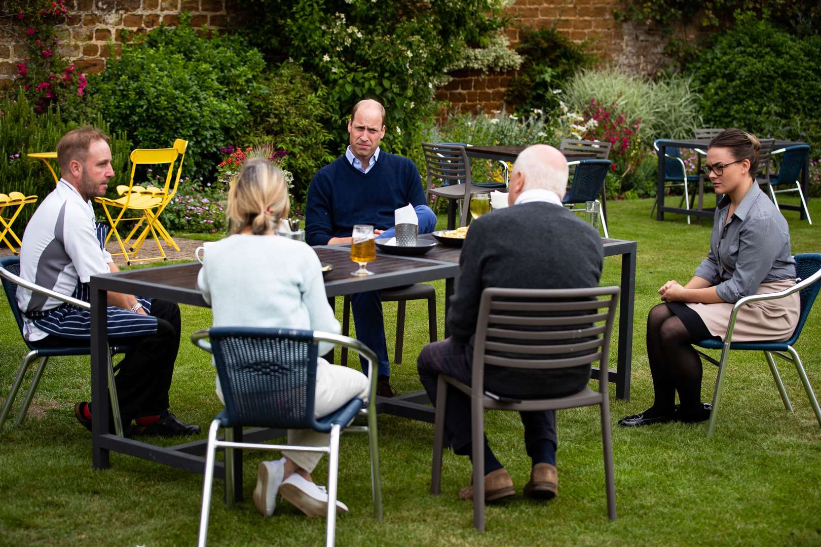 The duke with the landlords of the Rose & Crown and some of their staff (Aaron Chown/PA)