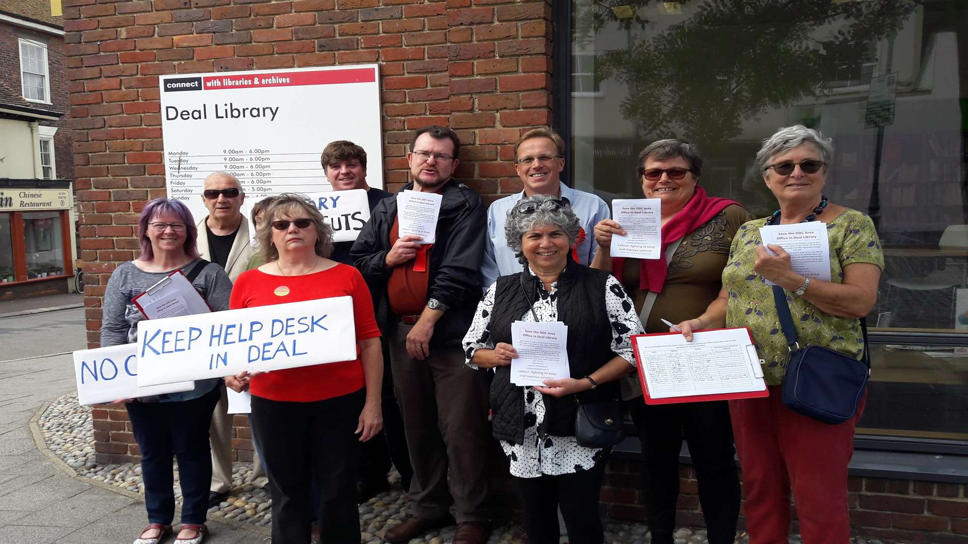 Protestors and concerned residents take part in a demonstration against plans to close the council help-desk based in Deal Library