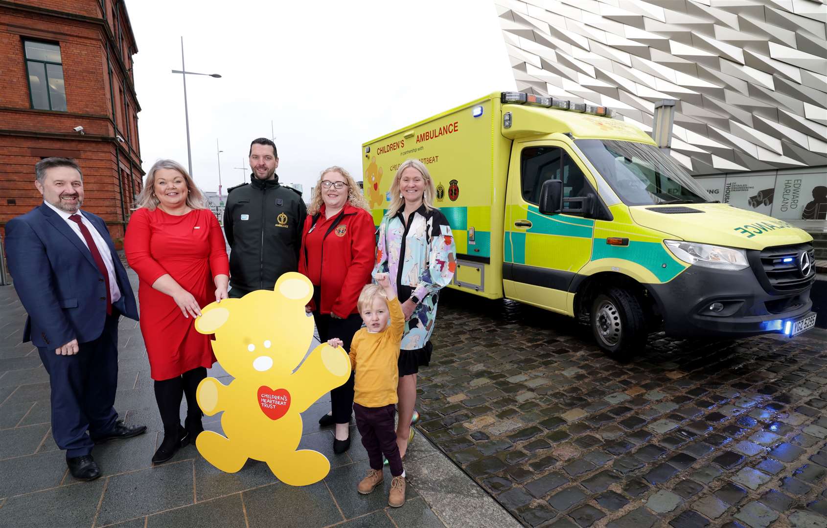 (l to r) Former health minister Robin Swann, Joanne McCallister, of Children’s Heartbeat Trust, Ciaran McKenna, of NIAS, Emma Thompson, lead nurse at NISTAR, Edel McInerney, from Lisburn and her son, Fionn (William Cherry/Presseye/PA)