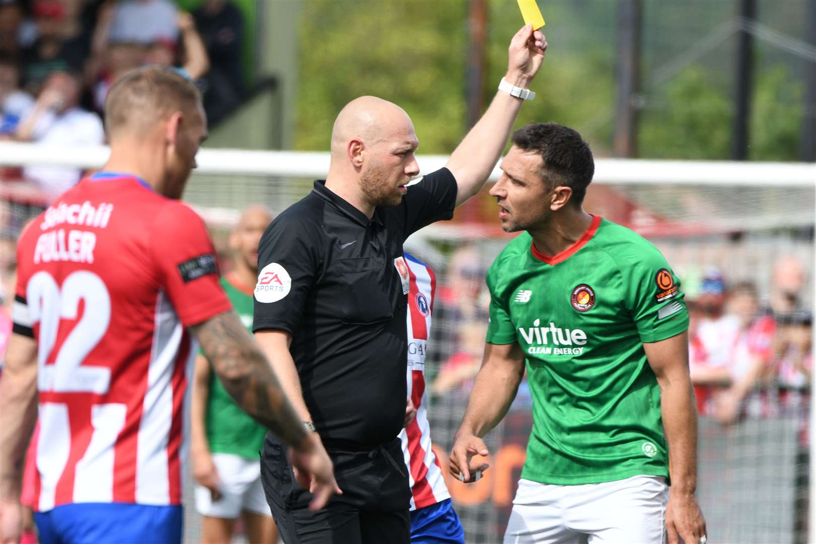 Ebbsfleet's Joe Martin is booked by referee Jason Richardson. Picture: Barry Goodwin