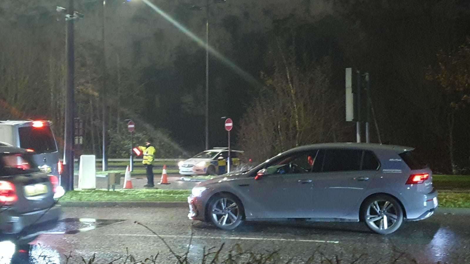 Police temporarily shut a road while officers responded.