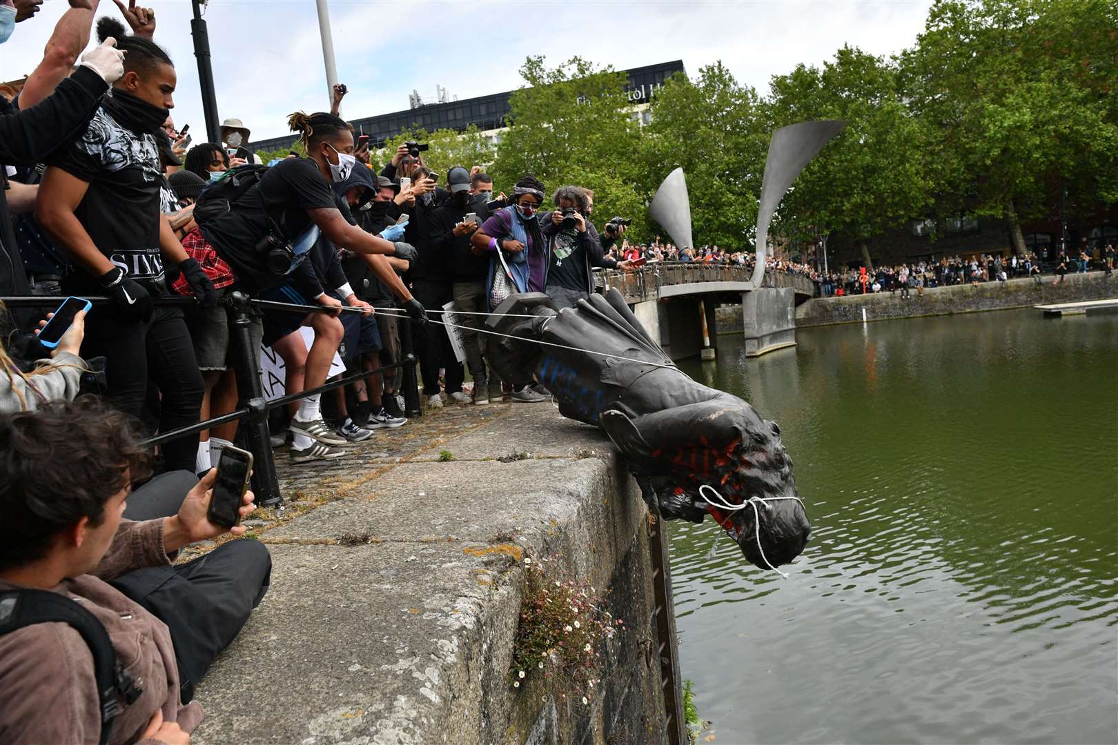 Protesters throw the statue of Edward Colston into Bristol Harbour (Ben Birchall/PA)