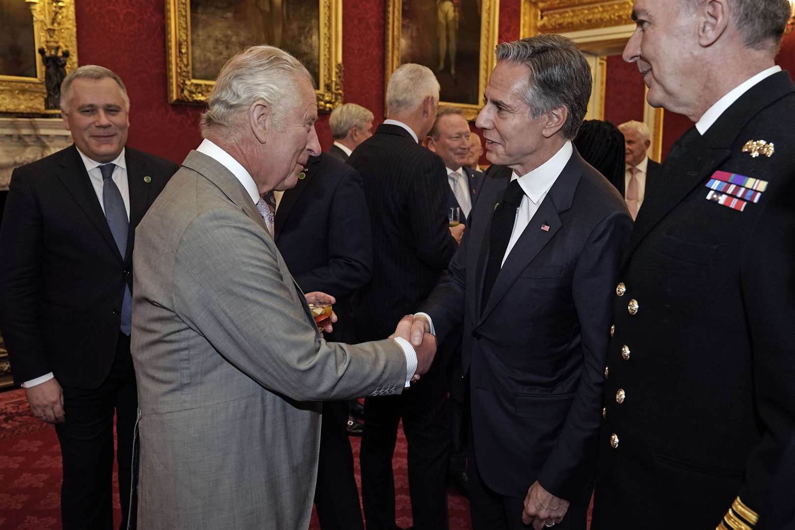 The King shakes hands with US Secretary of state Antony Blinken (Aaron Chown/PA)