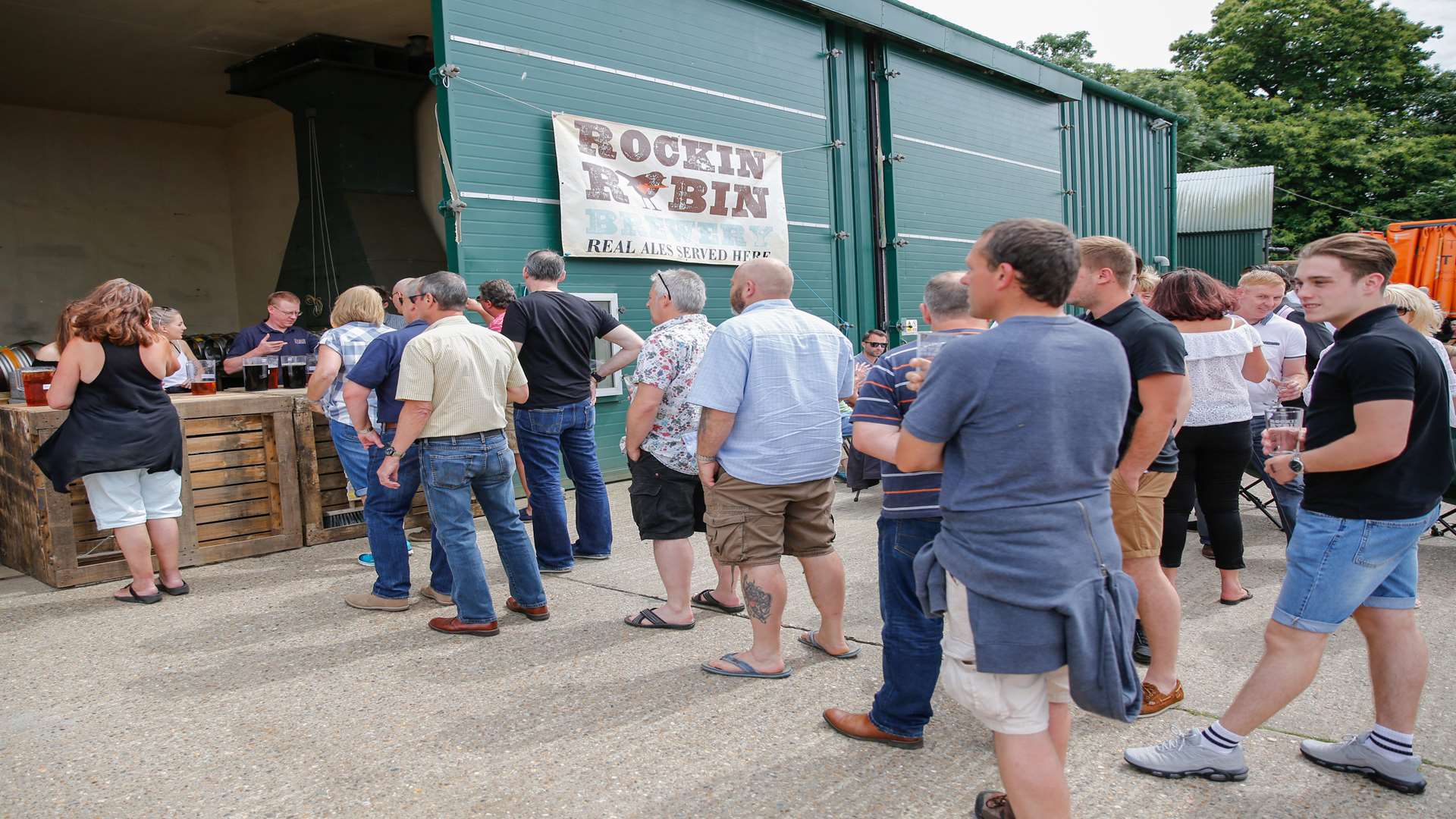 Drinker queue for their pints