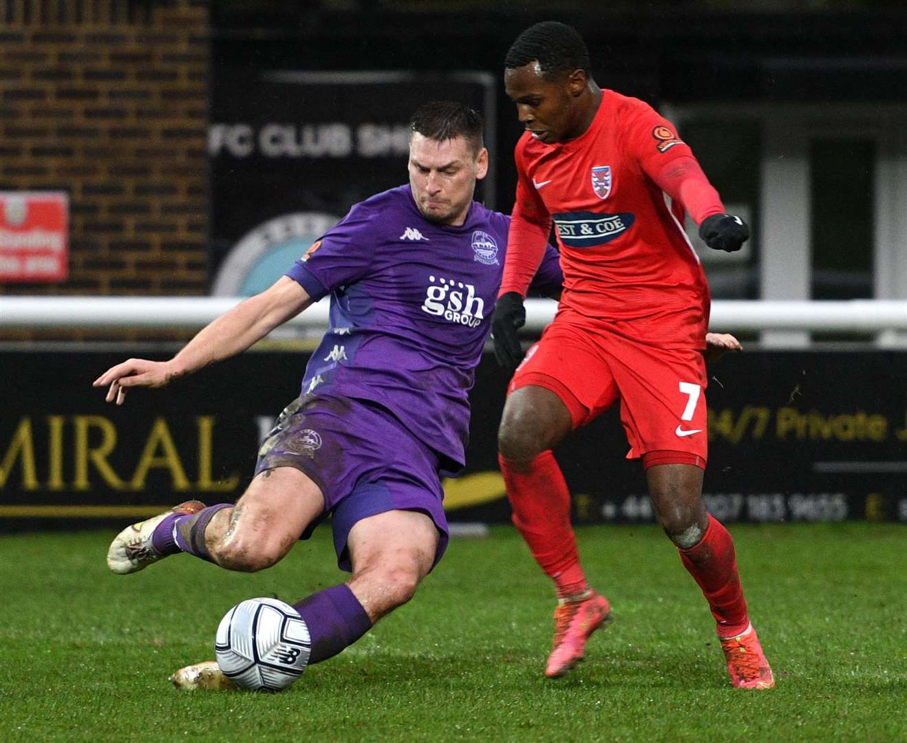 Dover defender Jake Goodman gets stuck in during their Boxing Day defeat to Dagenham. Picture: Barry Goodwin
