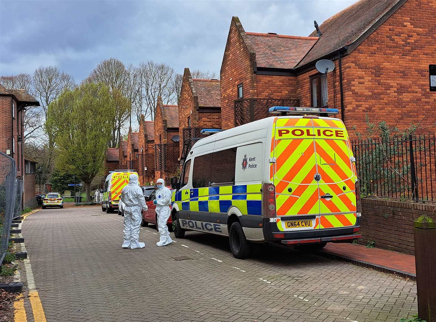 Police and forensics investigate a suspected murder after a man was found dead in Castle Street car park in Canterbury