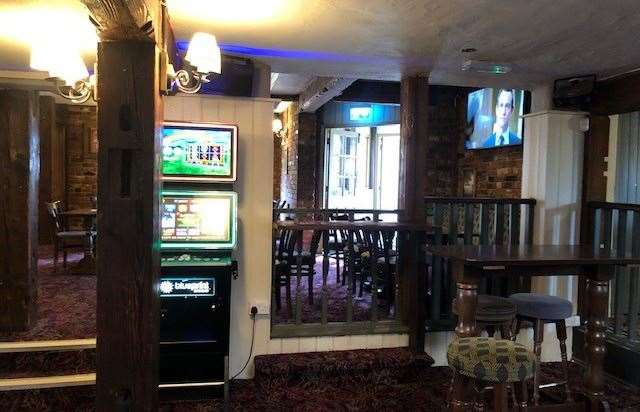 The central bar was quiet but earlier our barmaid had been trying to extract some change from the fruit machine