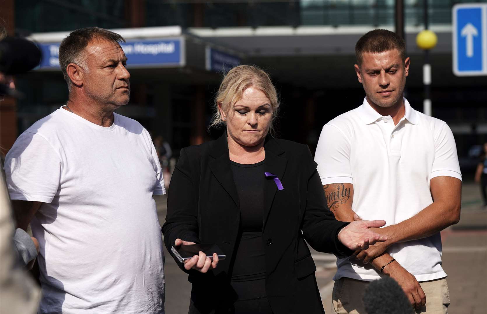 Paul Battersbee and Hollie Dance speak to the media outside the Royal London Hospital (Yui Mok/PA)