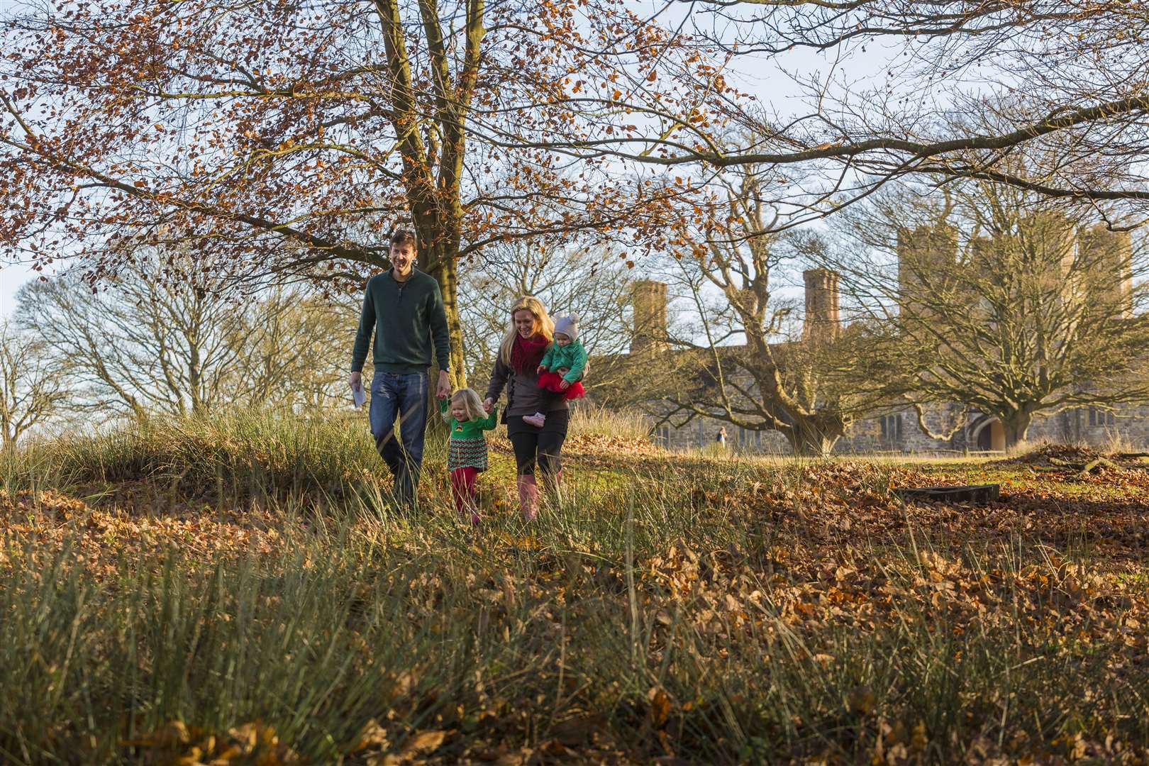 Visitors walking through Knole's vast parklands in Sevenoaks