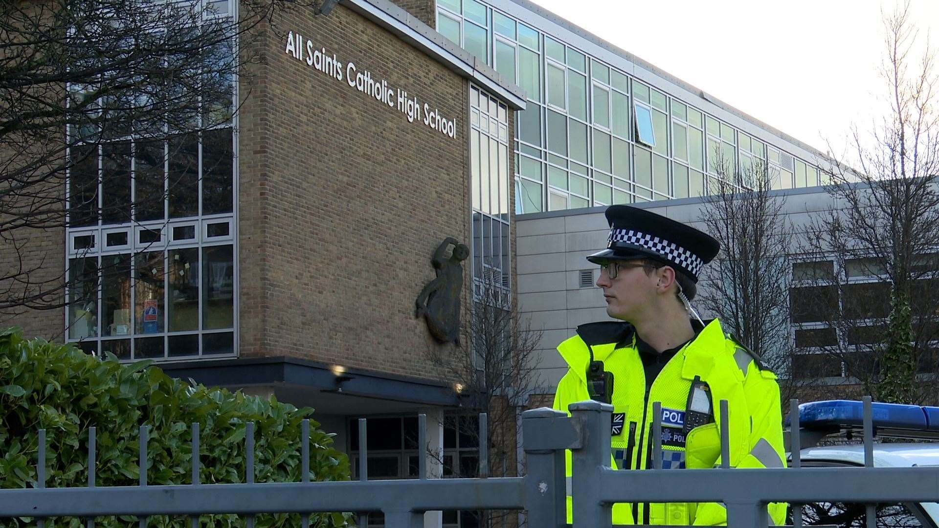 Police officers outside All Saints Catholic High School (Richard McCarthy/PA)