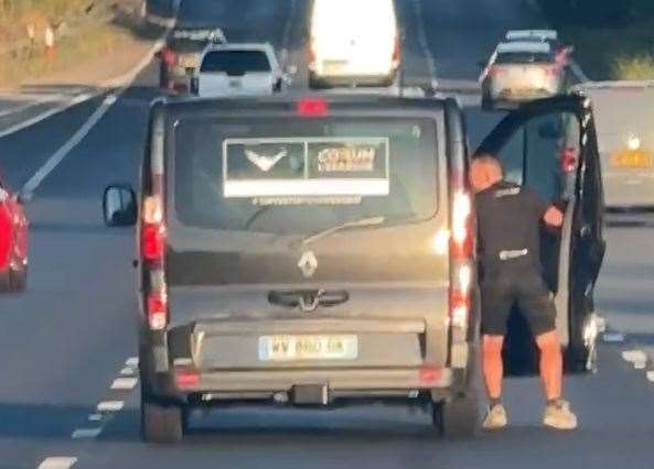 A passenger was spotted hanging out of a van on the M20 at Ashford