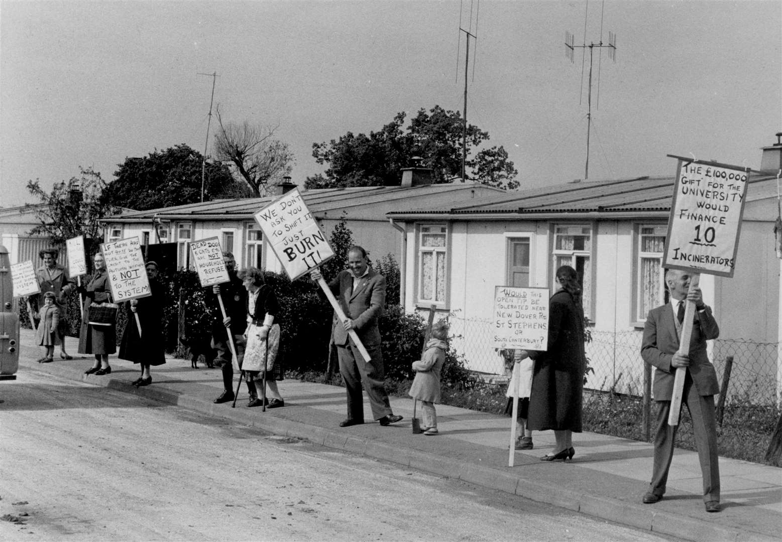 Banner-waving residents unhappy at the flies and smells from Canterbury's rubbish dump.