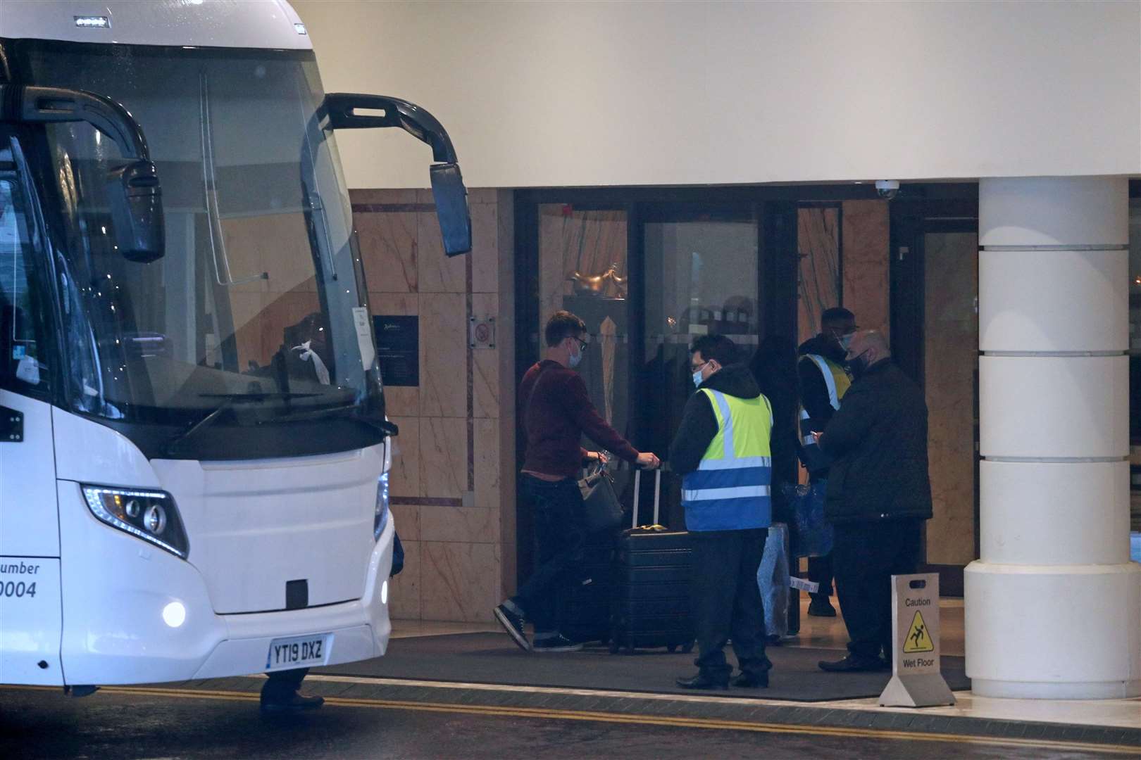 A coach delivers passengers to the Radisson Blu Edwardian Hotel (Steve Parsons/PA)