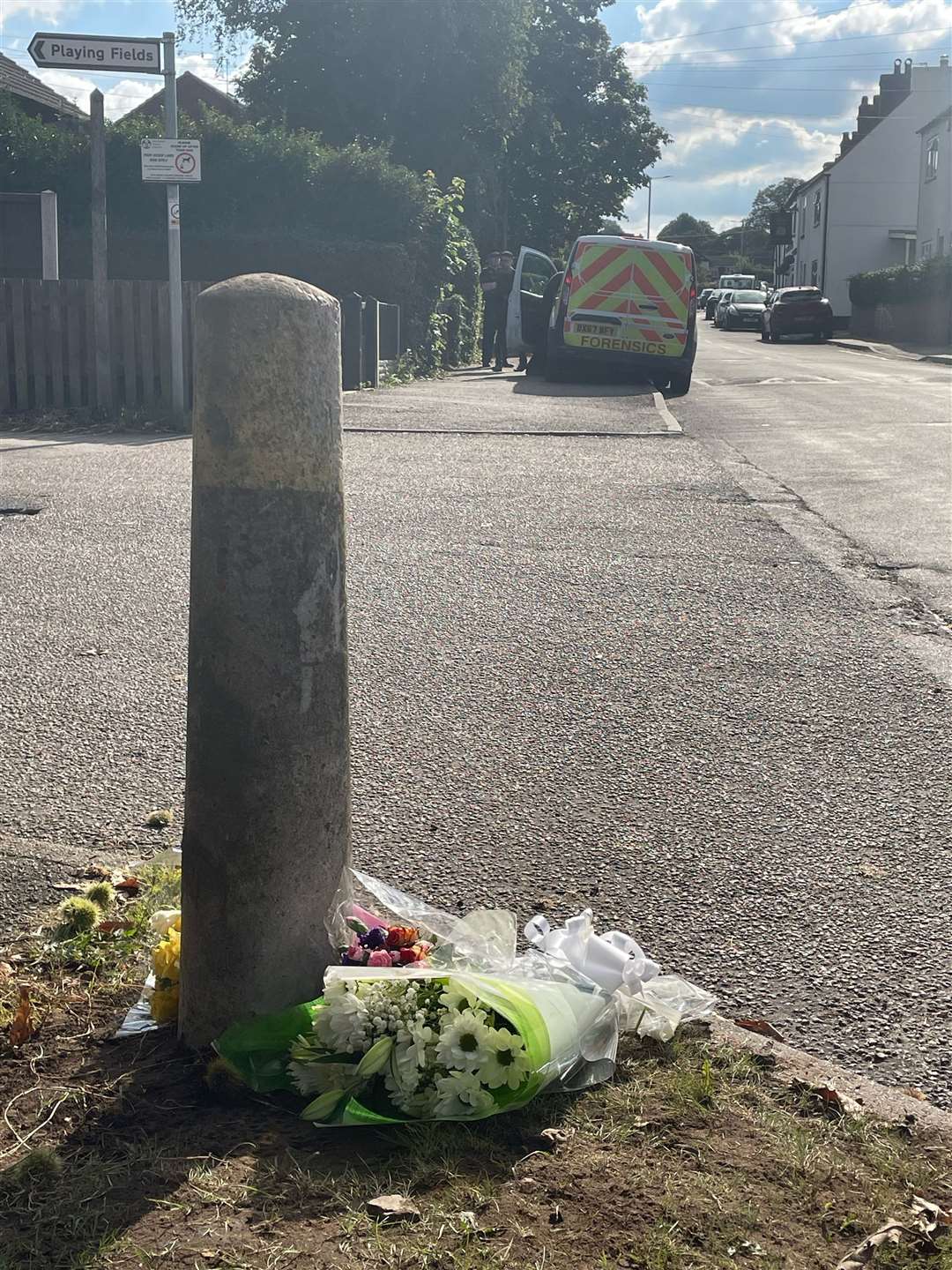 Floral tributes were left outside the scene in Mr Price’s memory (Matthew Cooper/PA)