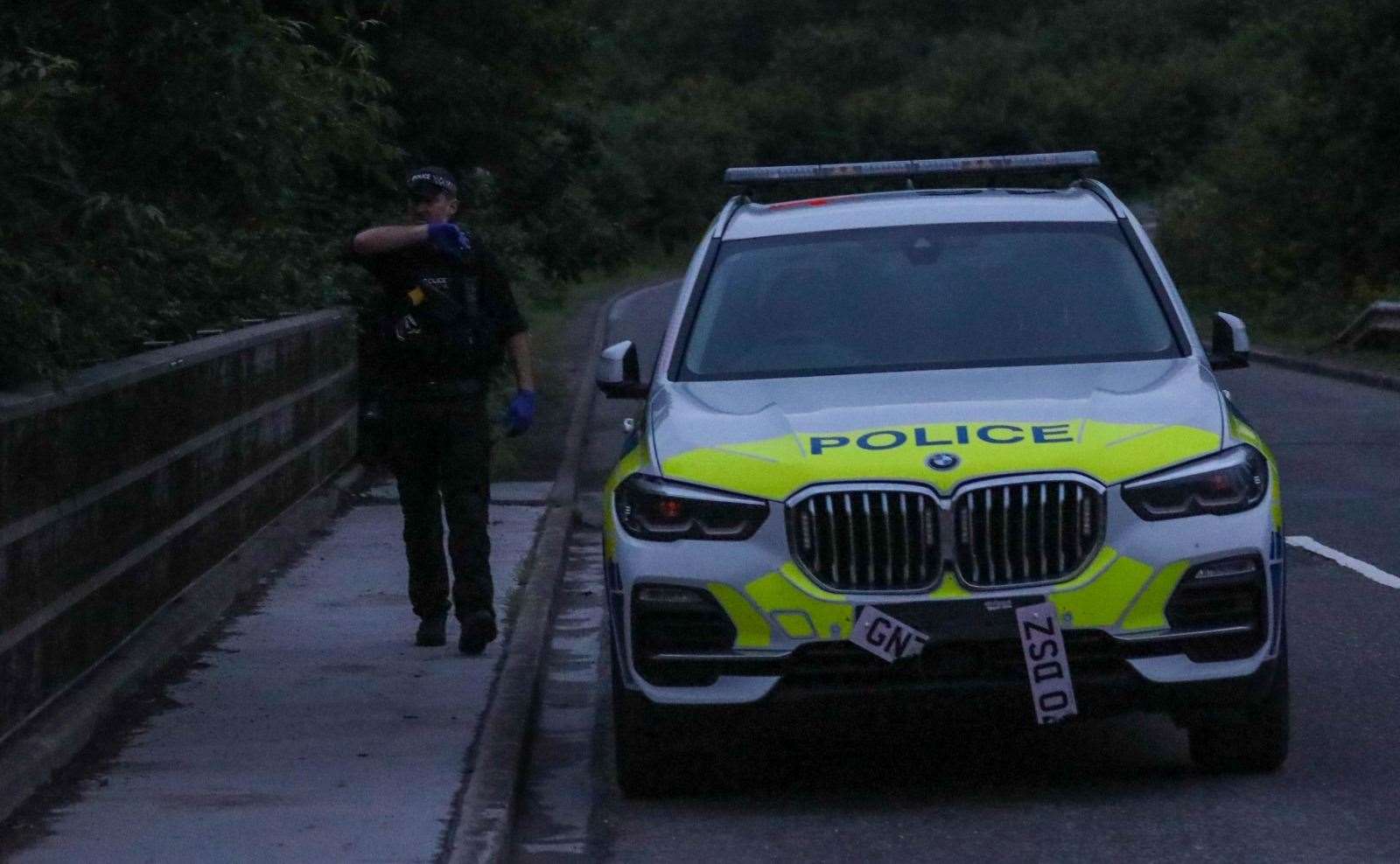 Police were also seen at Chattenden near the Four Elms roundabout in the early hours searching woodland with sniffer dog teams. A police BMW X5 was damaged. Picture: UKNIP