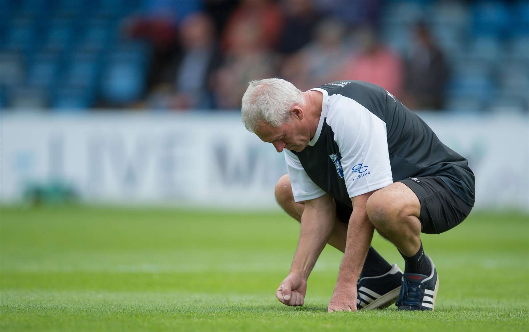 Gillingham head groundsman John Plummer works on the Priestfield pitch Picture: Ady Kerry