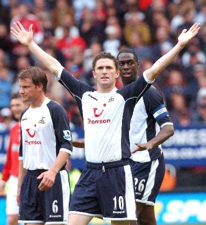 Robbie Keane acknowledges the away support after scoring the winner in a dramatic Tottenham comeback at The Valley. Picture by MATTHEW WALKER