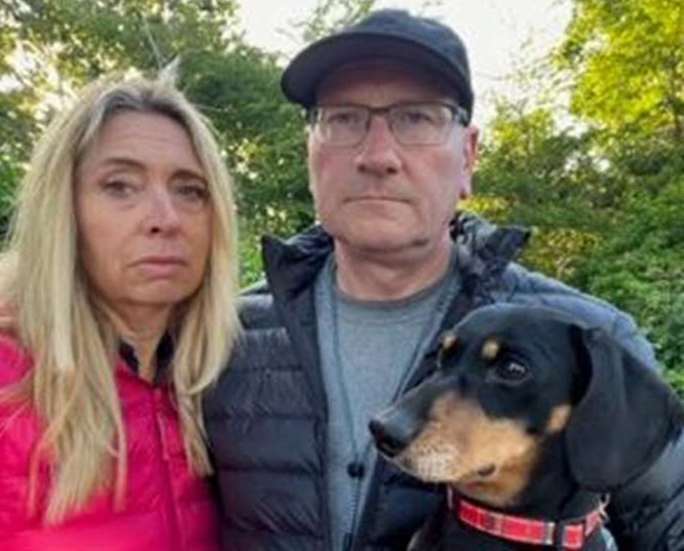 Mrs and Mr Ground with their dog, Henry, who survived the attack