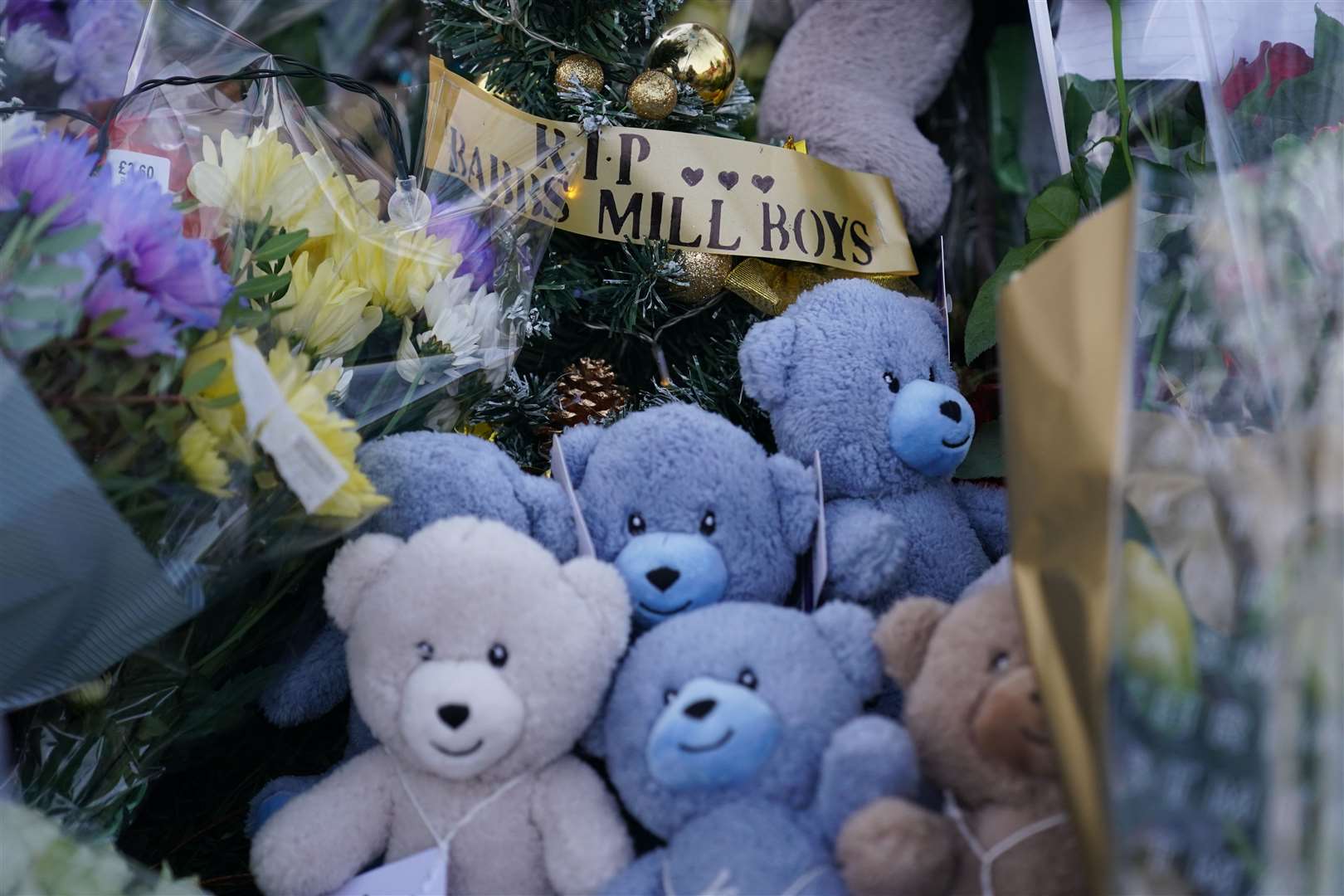 Flowers and tributes near to Babbs Mill Park (Jacob King/PA)