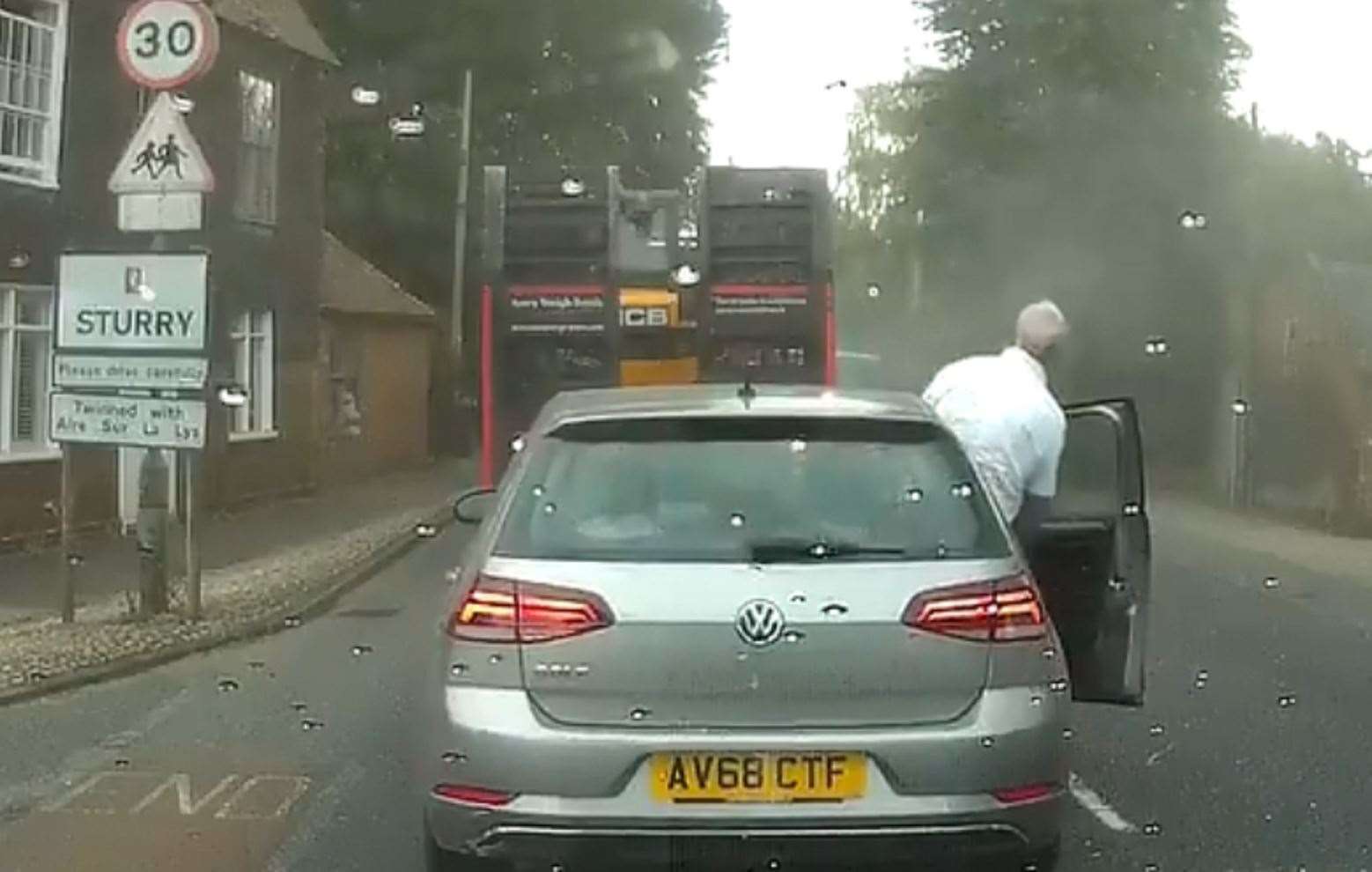 A driver leans out of his car to get a closer look. Pic: AngryBritain / Twitter (13676604)