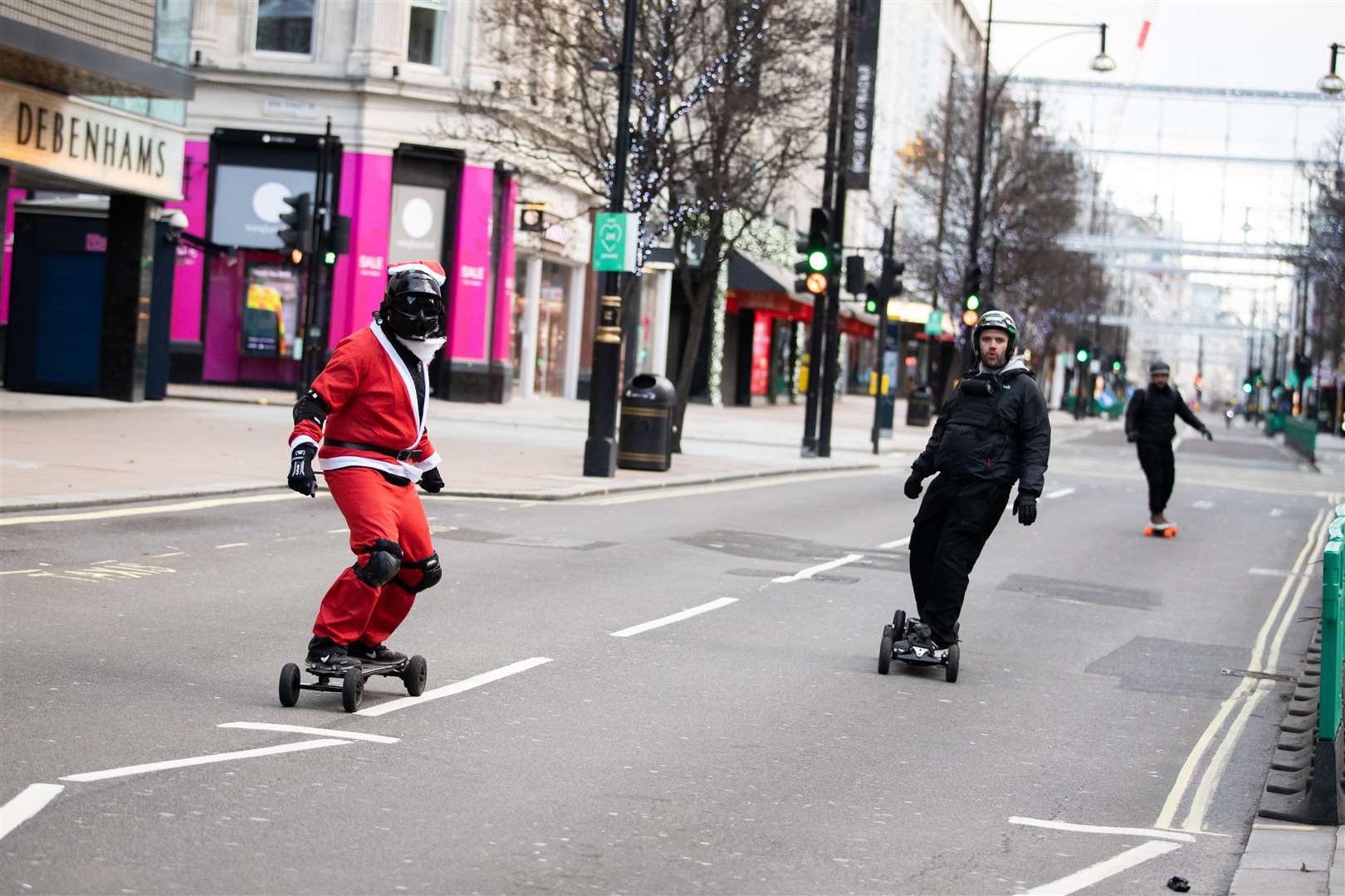 A festive skateboarder takes advantage of an empty Oxford Street in London (Aaron Chown/PA)