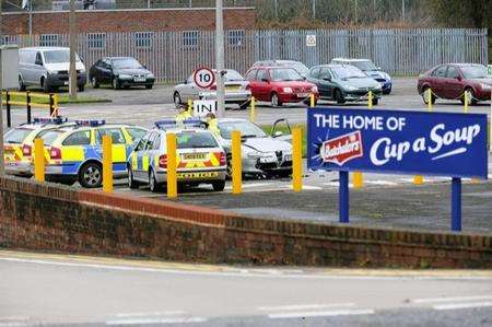 Police at the scene of an incident at Batcholers site, Kennington Road, Ashford.