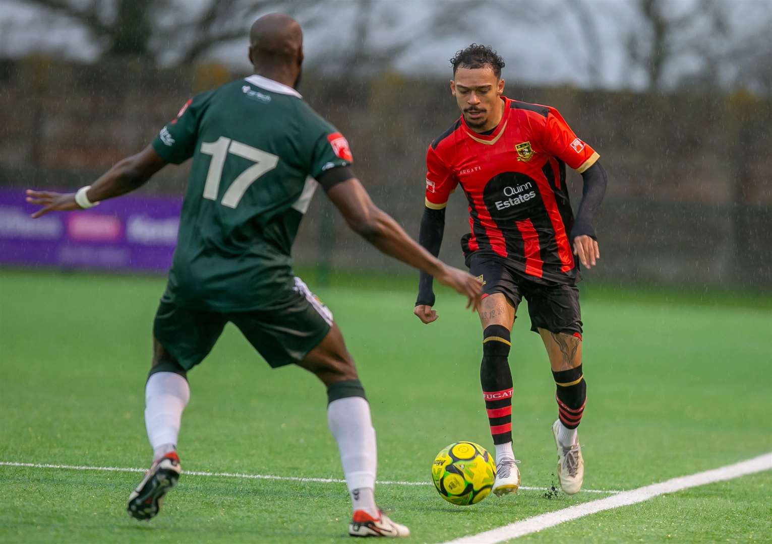 Sittingbourne winger Troy Howard runs at Ashford defender Tolu Jonah. Picture: Ian Scammell