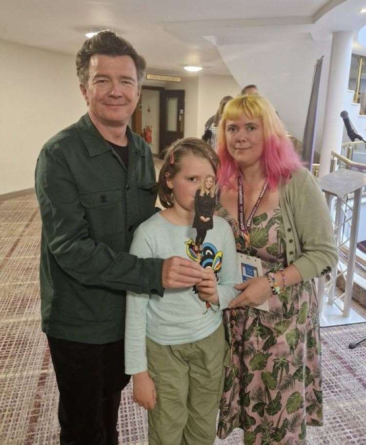 Rick Astley (left), with Helen Tamblyn-Saville (right) and her daughter (middle) and Chopstick Sally (Wonderland Bookshop/PA)