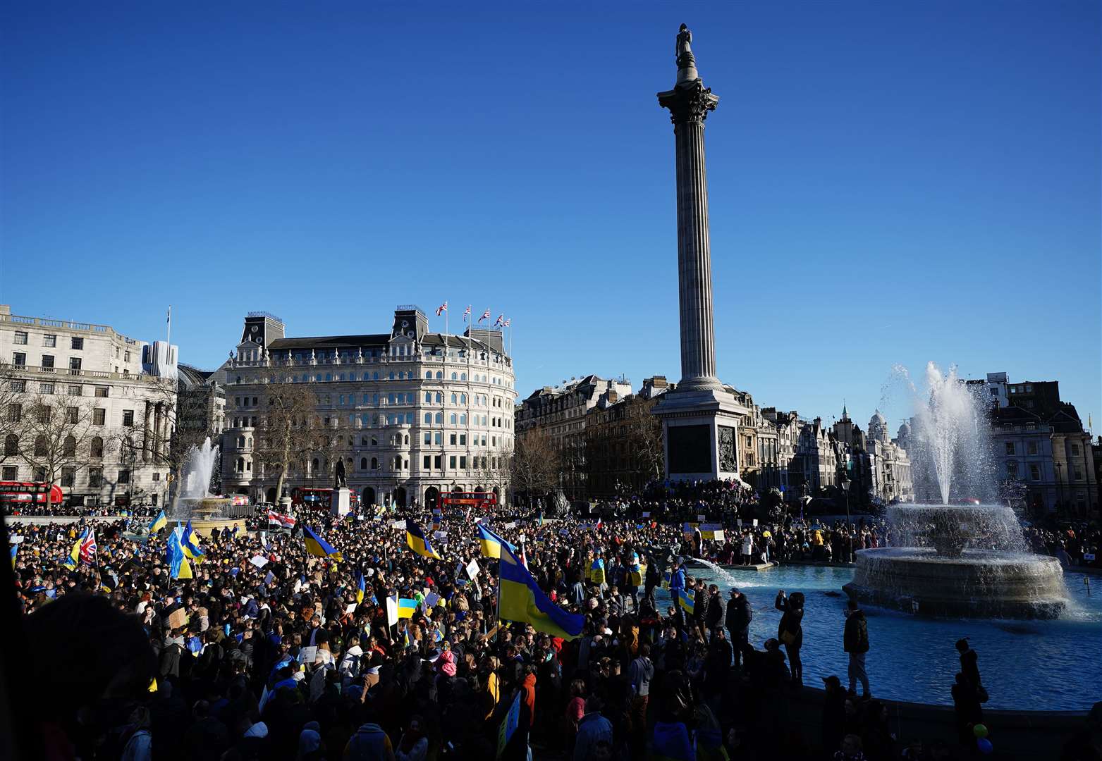 People take part in a demonstration in Trafalgar Square, London, to denounce the Russian invasion of Ukraine (Aaron Chown/PA)