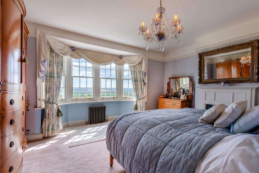 One of five bedrooms in the main house, offering views of the Romney Marsh. Picture: Strutt and Parker