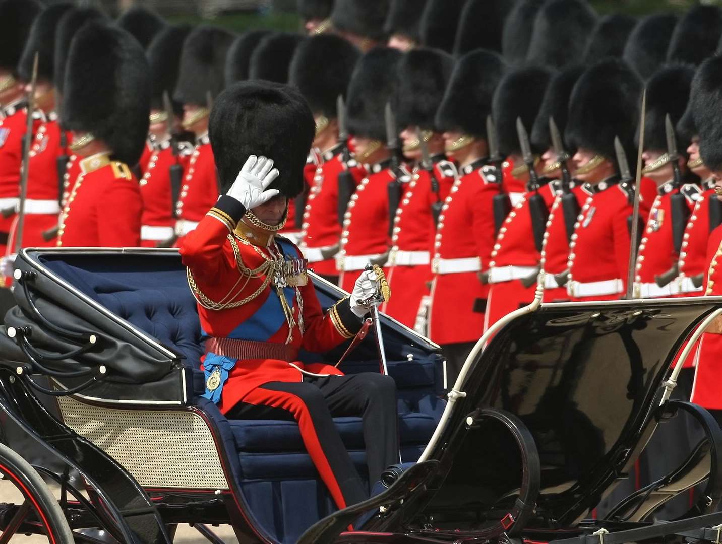 The Duke of Edinburgh, as Colonel of the Grenadier Guards, salutes the Guards regiments as Coldstream Guards stand to attention behind (Dominic Lipinski/PA)