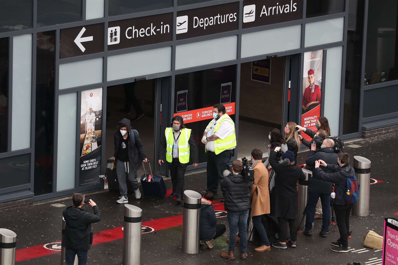 Passengers were escorted leaving Edinburgh airport to self-isolate for 10 days in a quarantine hotel room (Andrew Milligan/PA)