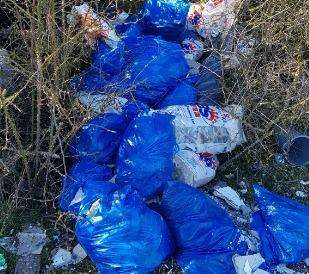 Concrete blocks, cement bags and plasterboard were also found strewn in the field (7515383)