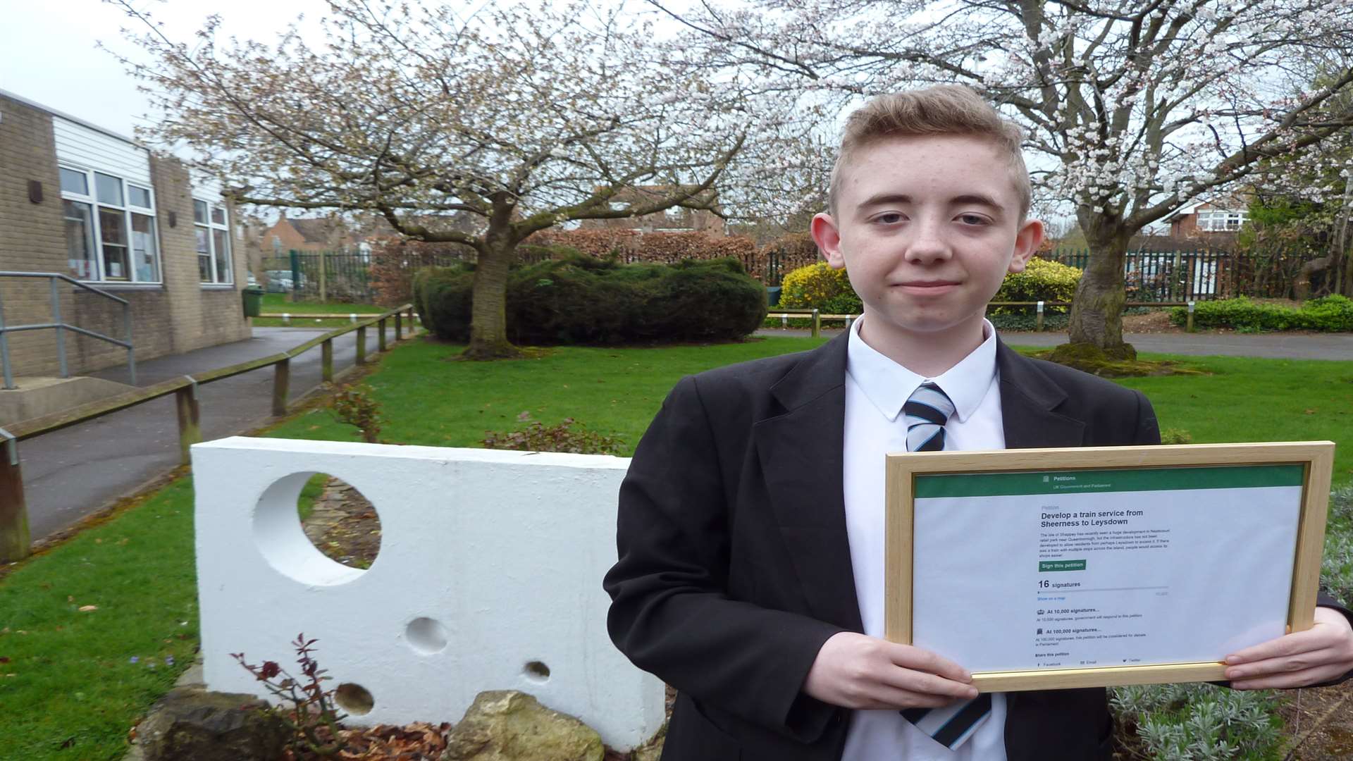 Henry Hurley, 14, with his petition to get a train running from Leysdown to Sheerness on the Isle of Sheppey.