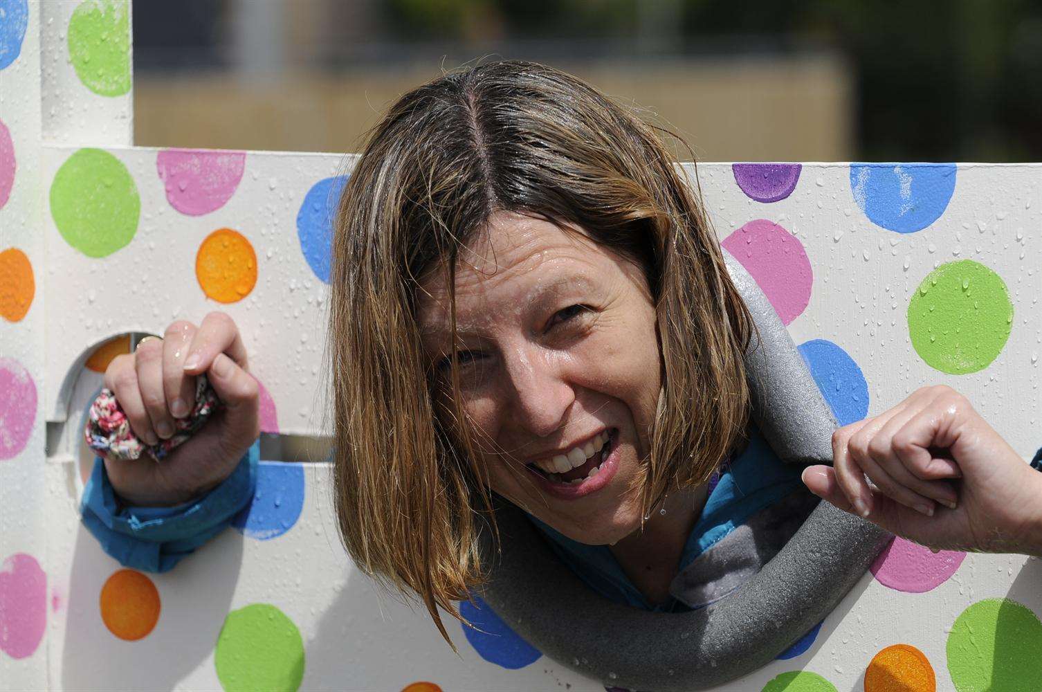 Goat Lees head teacher Teresa Adams gets wet in the stocks