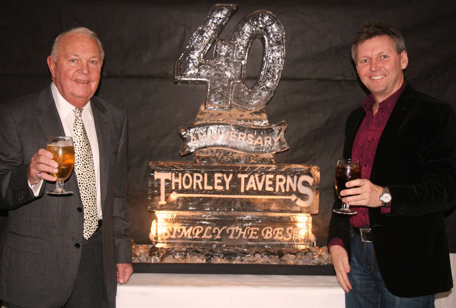 Frank Thorley and son Phil Thorley raise a glass to celebrate the 40th anniversary of Thorley Taverns in 2011